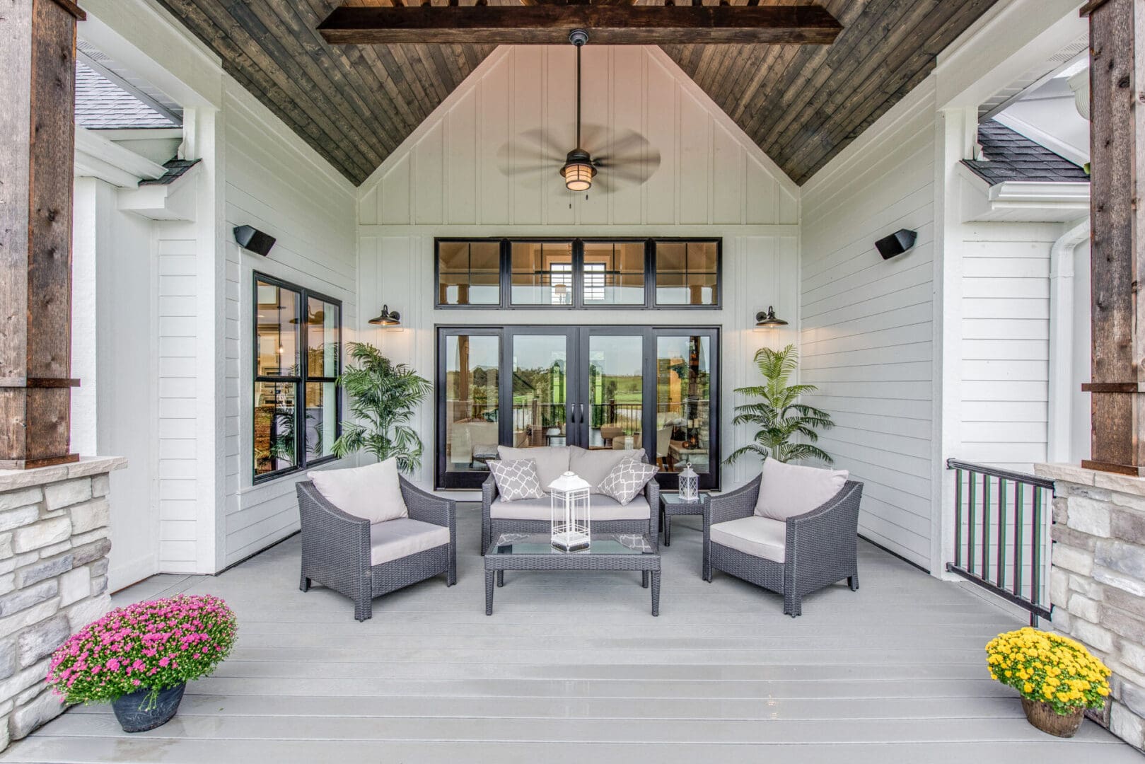 Wood panel vaulted covering on outdoor gathering area of new home